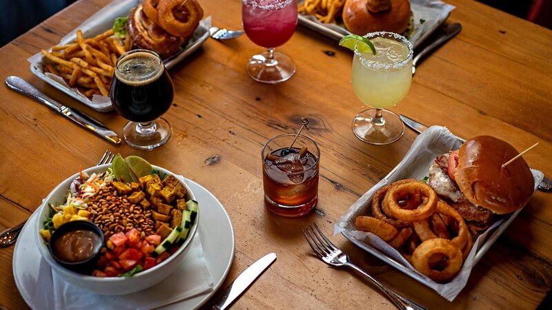 Table with multiple drinks and entrees