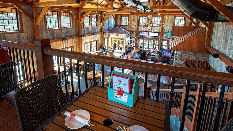 View of downstairs dining room from upper balcony