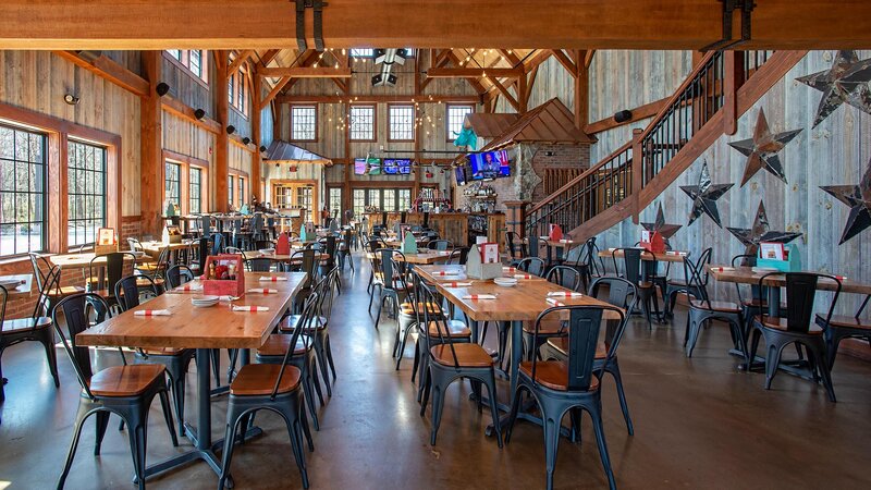 Downstairs dining room with many set tables